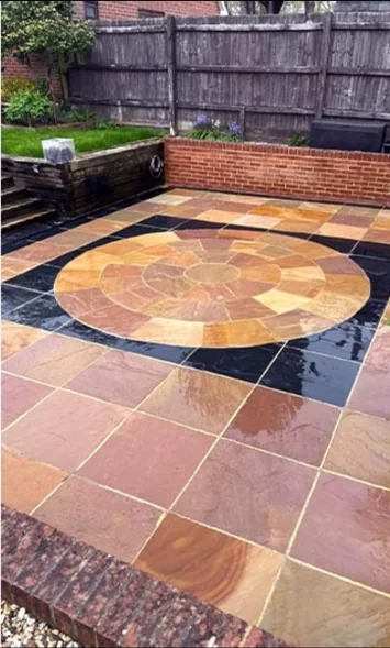 After: stone patio restored through pressure washing