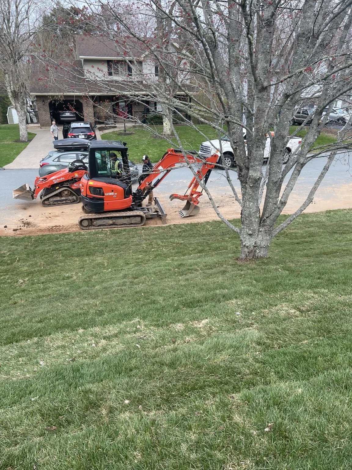 After: completed sod installation with a finished green lawn